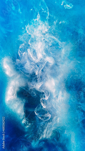 Paint splash background. Heaven cloud. Glowing blue white ethereal smoke puff flow spreading in abstract sky hypnotic shimmering glitter ink art.