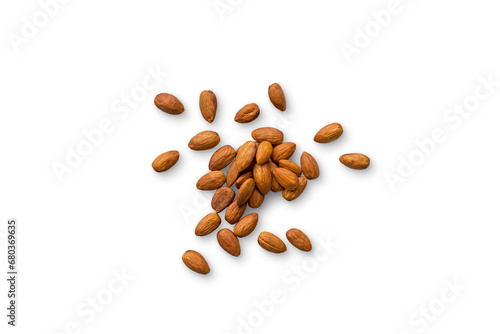 beautiful pile of roasted organic almonds with the peel isolated on a transparent background with shadows. Horizontal composition. Top view	
