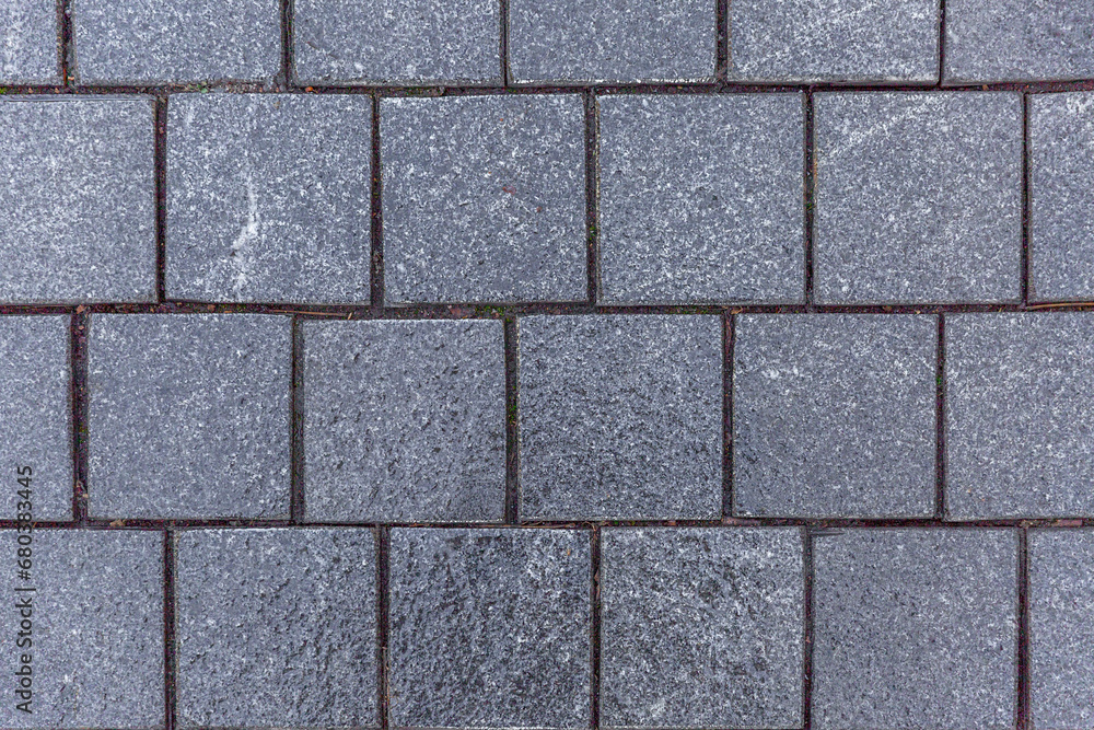 Naklejka premium Gray paving slabs. City design and architecture. Top view. Background. Space for text.