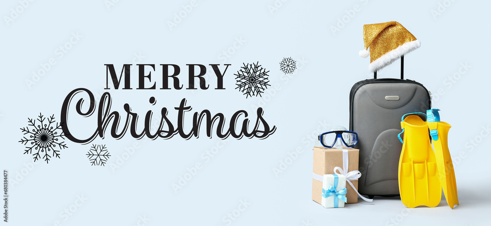 Naklejka premium Greeting banner for Merry Christmas with suitcase, beach accessories and gifts