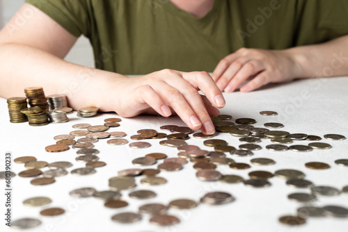 Counting coins on a wooden table