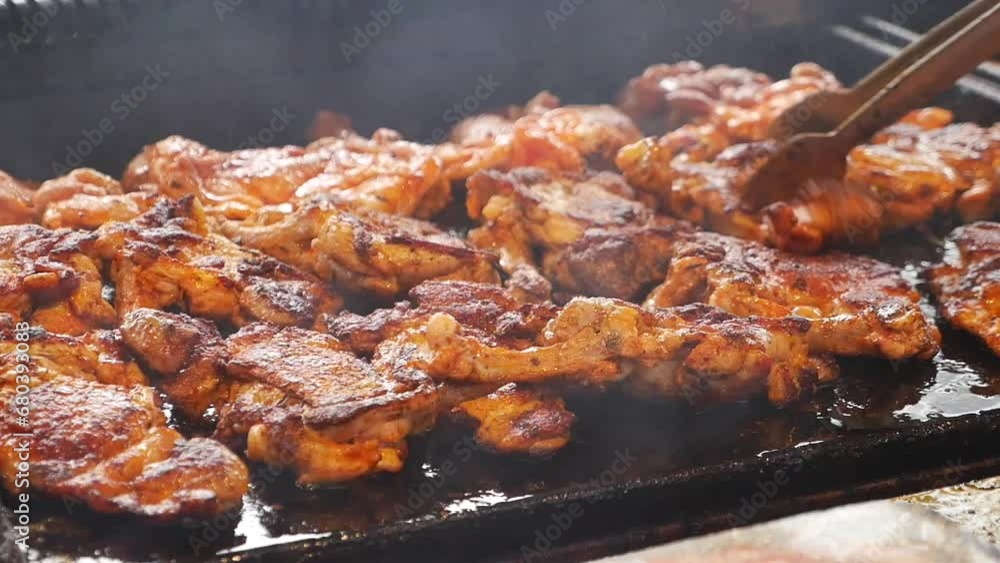 Beef and chicken steaks on the grill with flames. Beef and chicken steaks on the grill with flames.