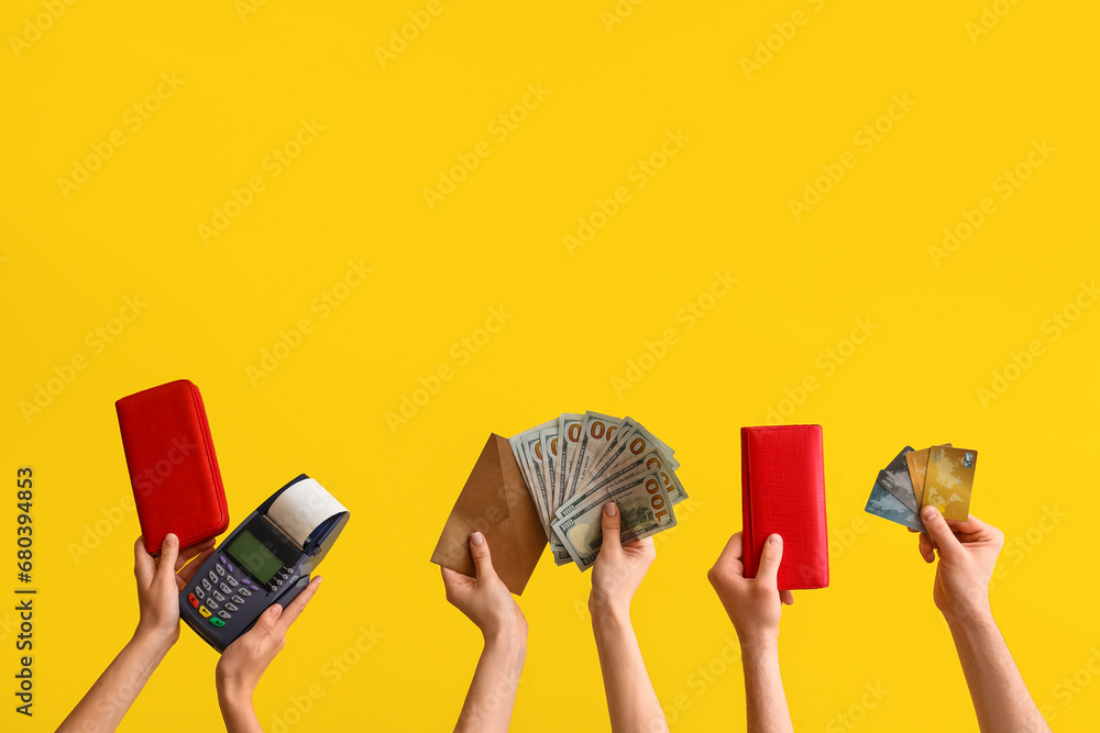 Female hands with wallets, payment terminal, credit cards and money on yellow background - obrazy, fototapety, plakaty 