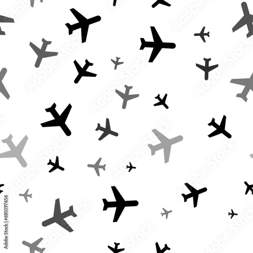 Seamless vector pattern with plane symbols, creating a creative monochrome background with rotated elements. Vector illustration on white background