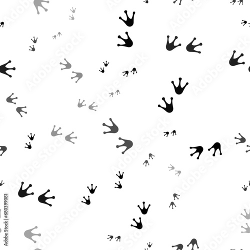 Seamless vector pattern with frog tracks symbols  creating a creative monochrome background with rotated elements. Vector illustration on white background