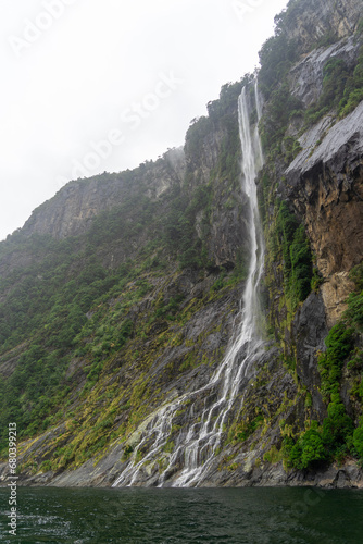 WATERFALLS IN MILFORD SOUND, NEW ZEALAND, FEBRUARY 2023