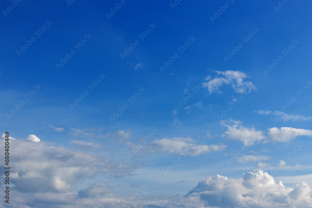 Blue sky background with tiny clouds. Cloudscape - Blue sky and white clouds. Clouds with blue sky Blue sky background with tiny clouds. Cloudscape - Blue sky and white clouds. Clouds with blue sky