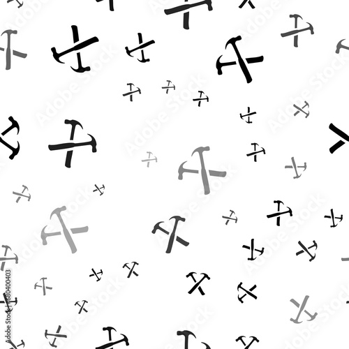 Seamless vector pattern with crossed hammers symbols  creating a creative monochrome background with rotated elements. Illustration on transparent background