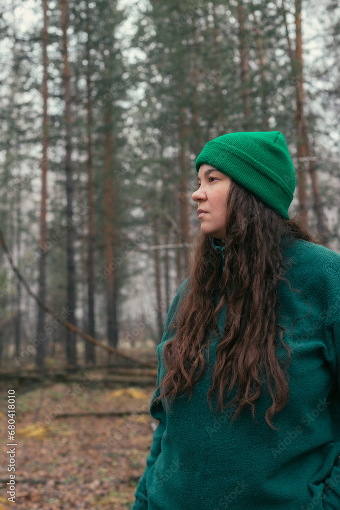 A girl walks in a pine forest A girl walks in a pine forest