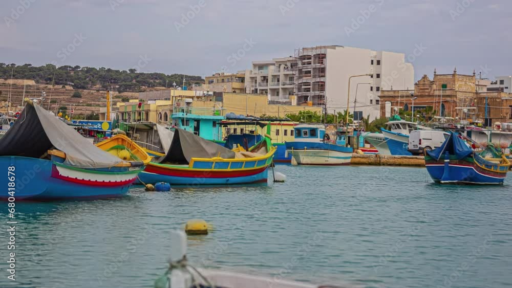 Traditional fishing boats in the Mediterranean Village of Marsaxlokk, Malta Traditional fishing boats in the Mediterranean Village of Marsaxlokk, Malta
