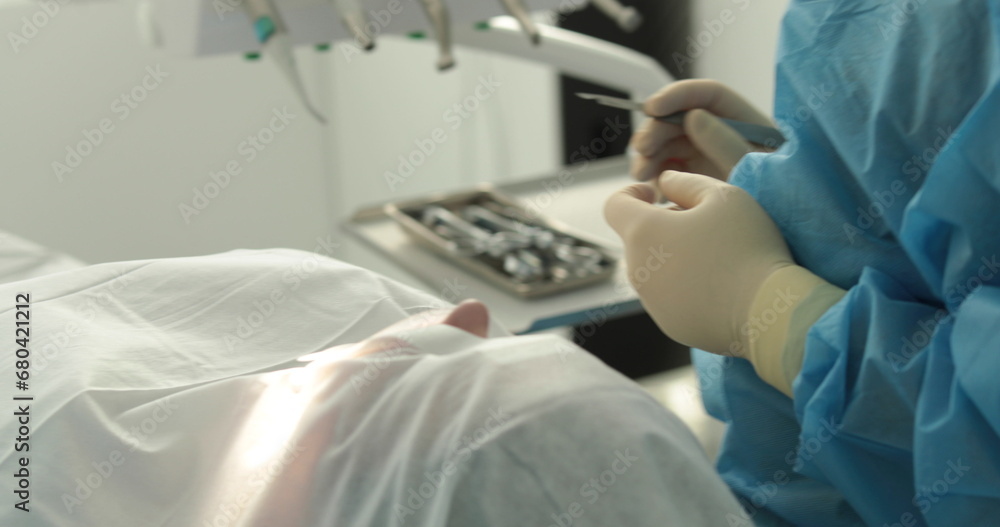 Dental treatment close-up. A dentist performs a dental procedure. Dentist's hands at work. Oral cavity in the process of treatment at the dentist. Dental treatment close-up. A dentist performs a dental procedure. Dentist's hands at work. Oral cavity in the process of treatment at the dentist.