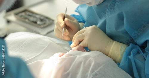 Dental treatment close-up. A dentist performs a dental procedure. Dentist's hands at work. Oral cavity in the process of treatment at the dentist. photo