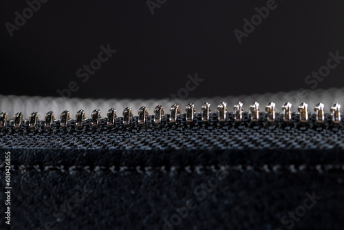 zipper on a black women's handbag close-up photo
