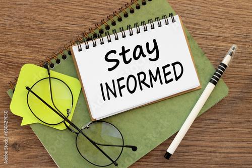 Wallpaper Mural Stay Informed two notepads on a work desk. a bright sticker and glasses Torontodigital.ca