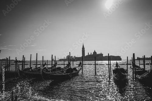 Black and White view of Gondolas on the water with large landscape in Venice, Italy, 