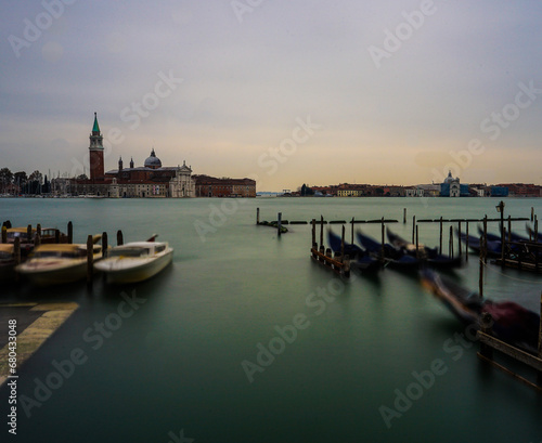 Moving Gondolas on the water with large landscape in Venice, Italy, Long Exposure