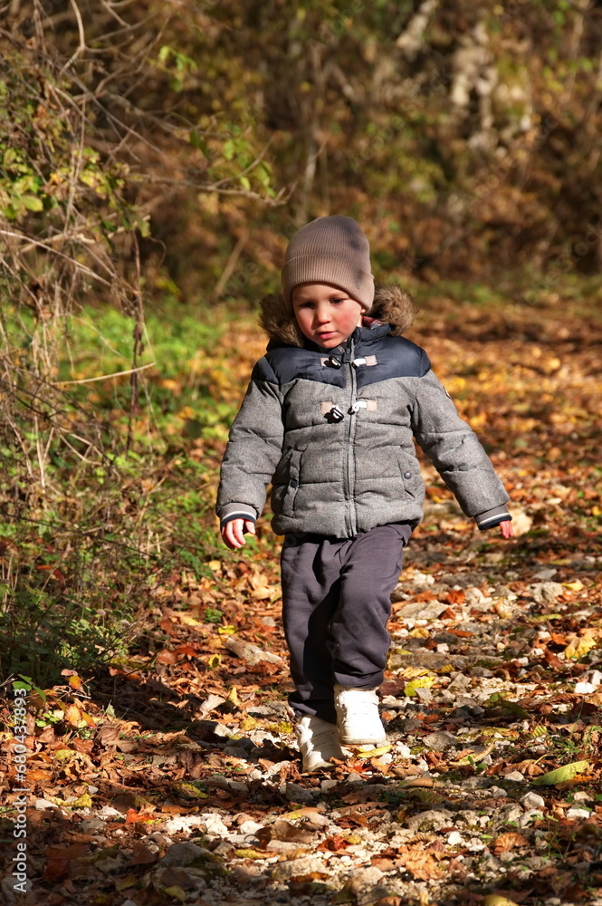 Little toddler walking in the forest Little toddler walking in the forest