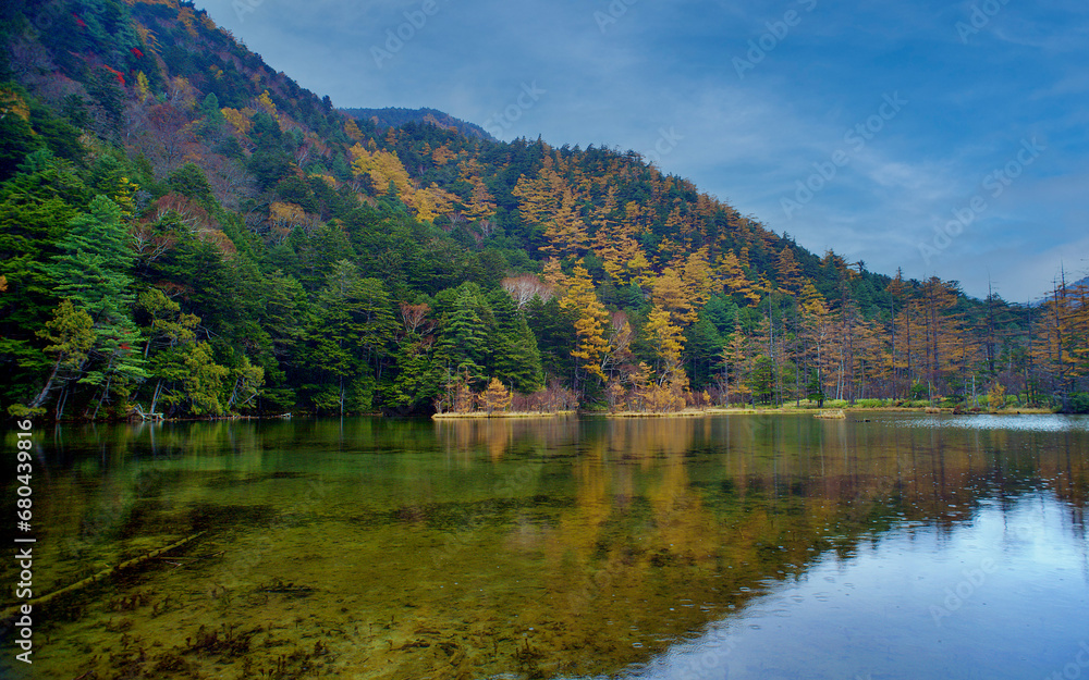 Idyllic landscape of Myojin pond at Hotaka Rear shrine in Kamikochi, Nagano, Japan (Japanese language meaning Idyllic landscape of Myojin pond at Hotaka Rear shrine in Kamikochi, Nagano, Japan (Japanese language meaning