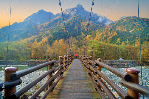 Scenery of Myojin bridge and Azusa river in late autumn at Kamikochi National Park, Matsumoto, Nagano, Japan