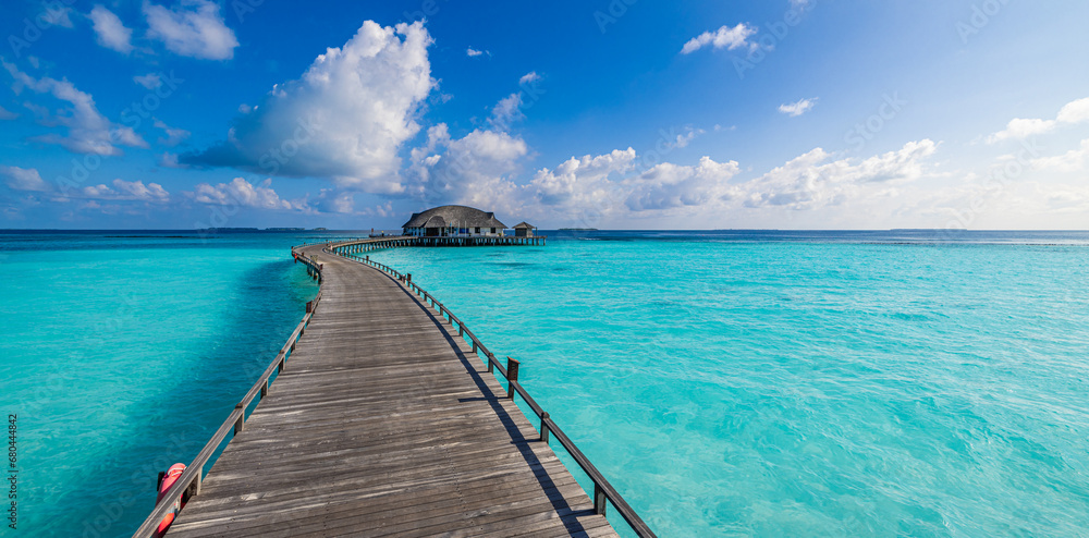 Maldives paradise island. Tropical aerial landscape, seascape long jetty pier water villas. Amazing sea sky sunny lagoon beach, tropical nature. Exotic tourism destination popular summer vacation