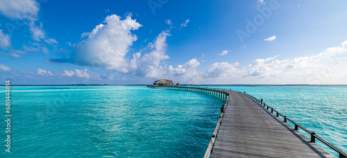 Maldives paradise island. Tropical aerial landscape, seascape long jetty pier water villas. Amazing sea sky sunny lagoon beach, tropical nature. Exotic tourism destination popular summer vacation