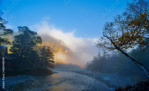 Kamikochi National Park in the Northern Japan Alps of Nagano Prefecture, Japan. Beautiful mountain in autumn leaf and Azusa river