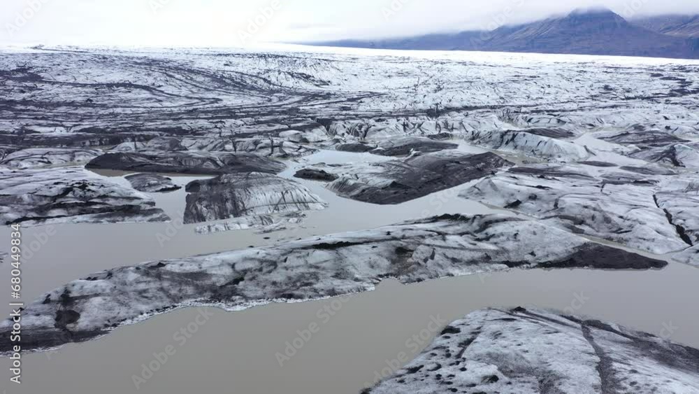 Aerial view of rapid melting glaciers and icebergs in Greenland by drone due climate change and global warming Aerial view of rapid melting glaciers and icebergs in Greenland by drone due climate change and global warming