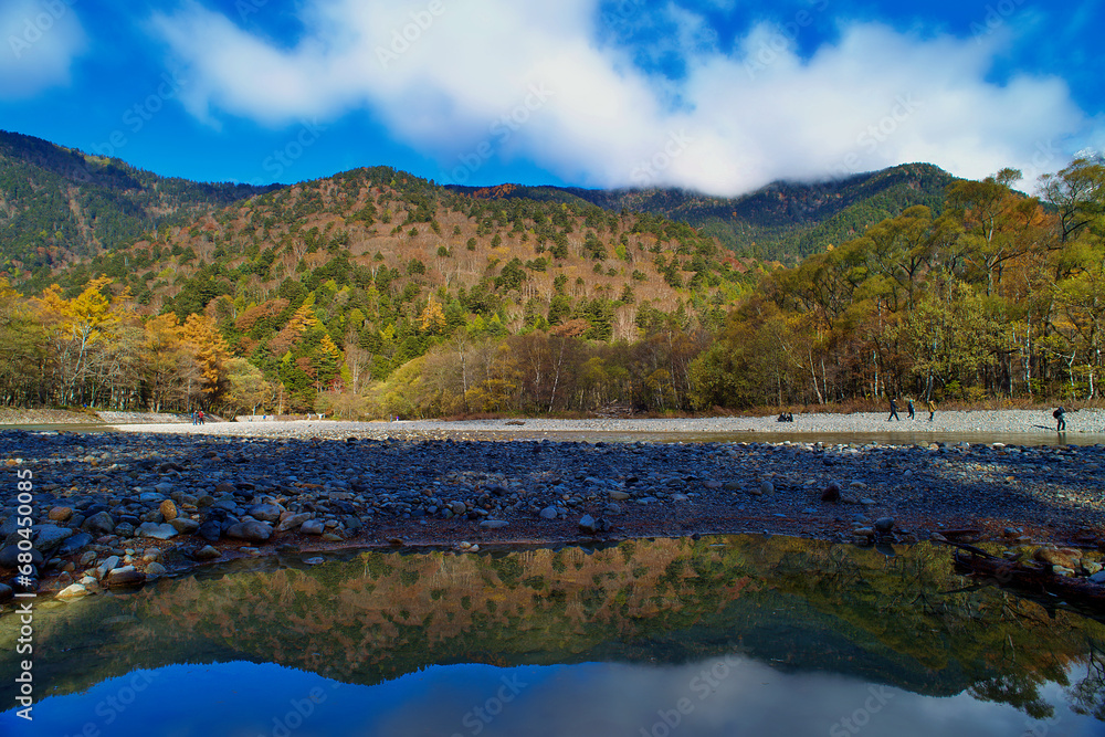 Kamikochi National Park in the Northern Japan Alps of Nagano Prefecture, Japan. Beautiful mountain in autumn leaf and Azusa river