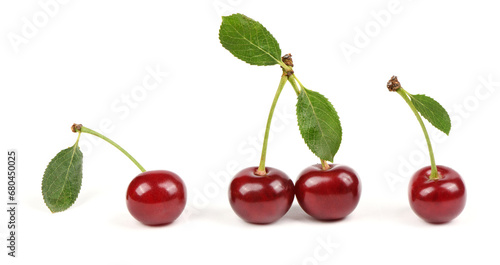 Collection of cherries with green leaf isolated on white background, side view. Extrem close-up.