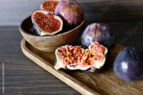 Fig fruit on a wooden plate neutral palette (ID: 680460603)
