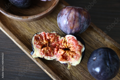 Fig fruit on a wooden plate neutral palette (ID: 680460623)