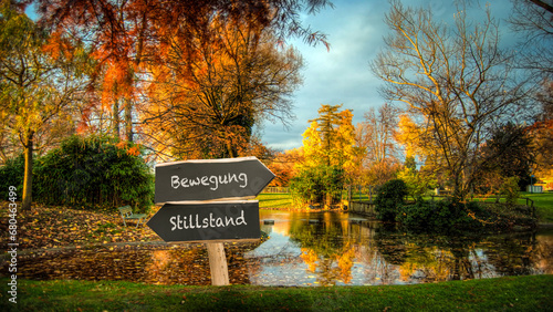 Фотография Signposts the direct way to Movement versus Standstill