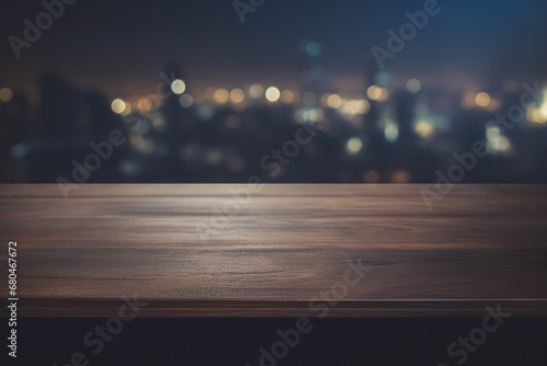 a dark wooden table top with a blurred city night light background