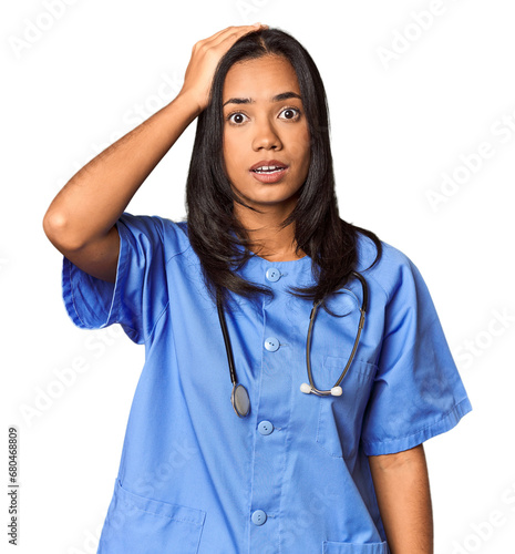 Young Filipina nurse posed in studio being shocked, she has remembered important meeting.