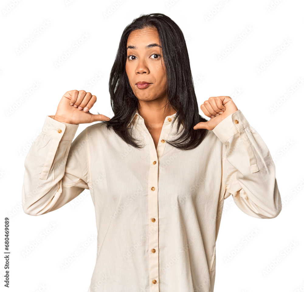 Young Filipina with long black hair in studio feels proud and self confident, example to follow. Young Filipina with long black hair in studio feels proud and self confident, example to follow.
