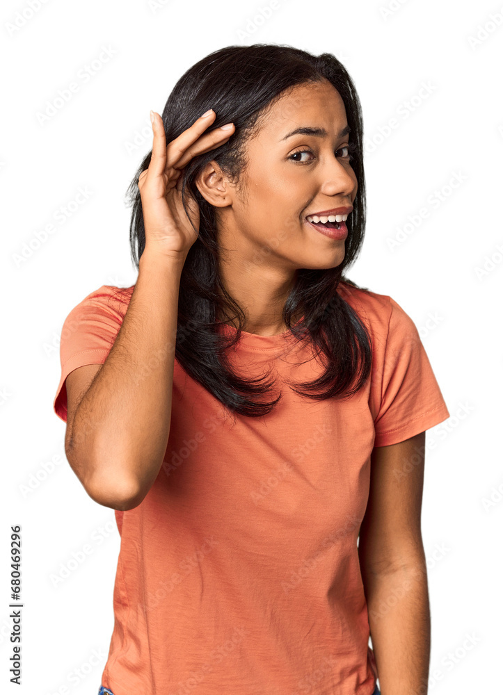 Young Filipina with long black hair in studio trying to listening a gossip. Young Filipina with long black hair in studio trying to listening a gossip.
