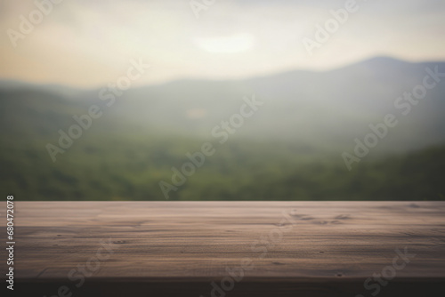 a rustic wooden table top with a blurred mountain valley background