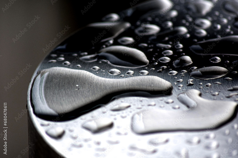 Macro of water drops on a metal surface