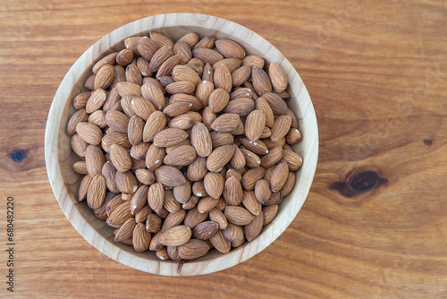 Almond kernel in a bowl. Background view from above. Healthy food
