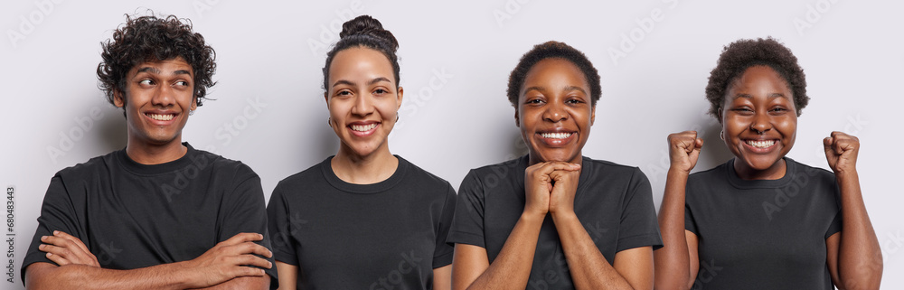 Horizontal shot of cheerful women clench fists smile gladfully express happily glad Hindu man keeps arms folded has satisfied expression isolated over white background. Four people stand in row - obrazy, fototapety, plakaty 