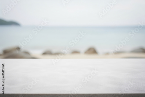 a rock table top with a blurred serene ocean beach background