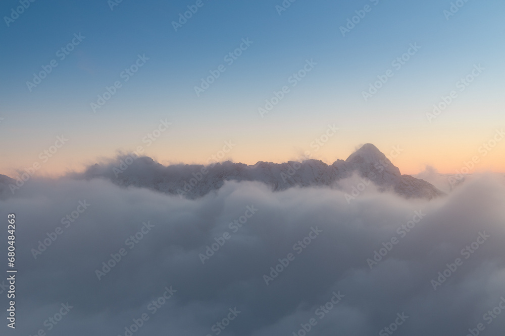 A sea of ​​clouds admired from the top of Kozi Wierch during an amazing sunset