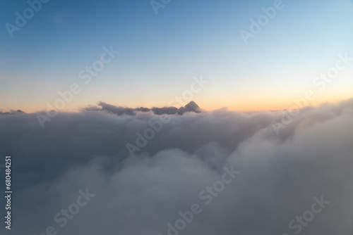 A sea of ​​clouds admired from the top of Kozi Wierch during an amazing sunset