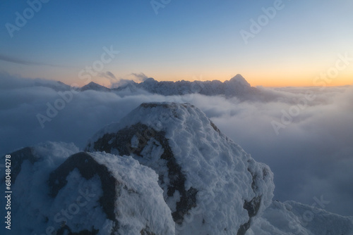 A sea of ​​clouds admired from the top of Kozi Wierch during an amazing sunset photo