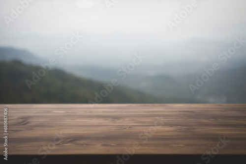 a wooden table top with a blurred mountain valley background