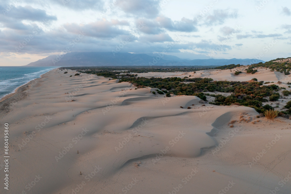 Beach and waves from top view. Turquoise water background from top view. Summer seascape with dunes from air. Top view from drone. Travel concept and idea