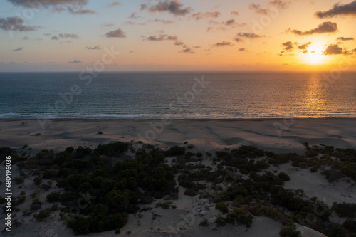 Beach and waves from top view. Turquoise water background from top view. Summer seascape with dunes from air. Top view from drone. Travel concept and idea
