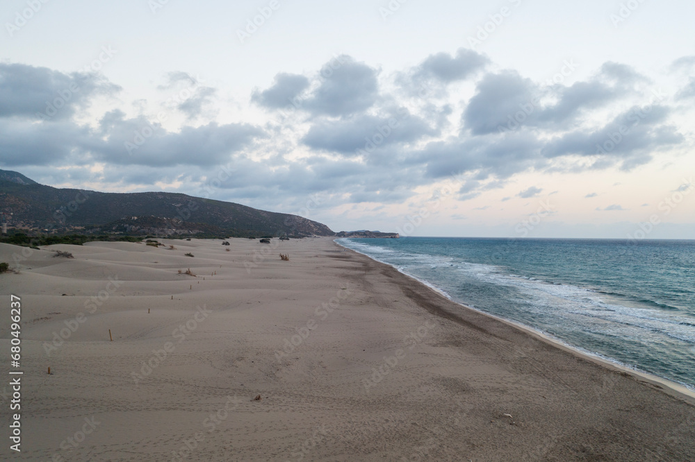 Beach and waves from top view. Turquoise water background from top view. Summer seascape with dunes from air. Top view from drone. Travel concept and idea