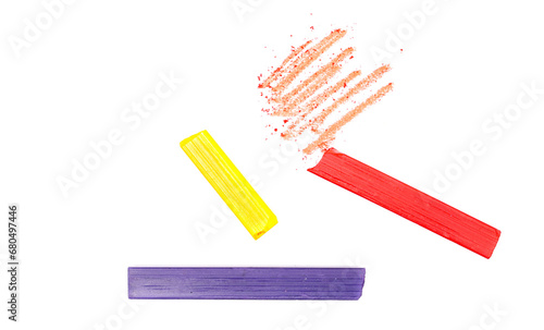 Colorful chalks with scribbles isolated on white  clipping path  top view 