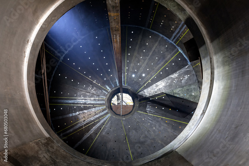 Inside view of the large sag and ball mill. A ball mill and a sag mill is a type of grinder used to grind and blend materials for use in mineral dressing processes. photo